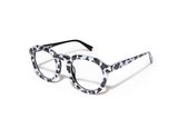 Image of Cheeterz Club eyewear. Photo of round eyeglasses with clear lenses and blue light blocking technology. The frames are medium width with white and black color and cheetah print, suitable for square, oval, and oblong face shapes. These glasses can be used as reading glasses with blue light glasses.