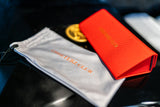  Image of Cheeterz Club eyewear pouch. Photo of red eyewear cases and environmentally friendly gray pouches for eyewear. These sustainable and eco-friendly pouches are designed to protect eyewear while reducing environmental impact.