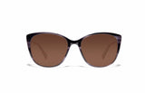 Image of Cheeterz Club eyewear. Photo of cat eye sunglasses with brown tinted lenses. The frames are small with smokey gray color and various shades of gray to accent, suitable for square, oval, and heart shaped face shapes. 
