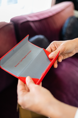 Image of Cheeterz Club eyewear pouch. Photo of red eyewear cases and environmentally friendly gray pouches for eyewear. These sustainable and eco-friendly pouches are designed to protect eyewear while reducing environmental impact.