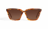 Image of Cheeterz Club eyewear. Photo of cat eye sunglasses with brown tinted lenses. The frames are medium width and golden brown color with honey and dark brown accents. Suitable for round, oval, and heart shaped face shapes. 