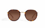 Image of Cheeterz Club eyewear. Photo of round sunglasses with brown tinted lenses.  The frames are small width and golden brown and mahogany color. Suitable for square, oval, and oblong shaped face shapes. 