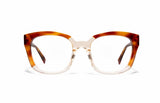  Image of Cheeterz Club eyewear. Photo of square eyeglasses with clear lenses and blue light blocking technology. The frames are wide width and custom laminated shades of honey, golden brown, and nude color with clear bottoms. Suitable for round, oval, and heart face shapes. These glasses can be used as reading glasses with blue light glasses.